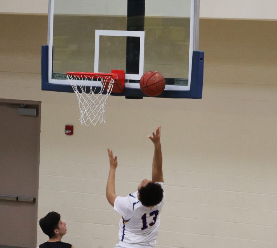 Junior Jamito Carr (13) is shoot a layup. 