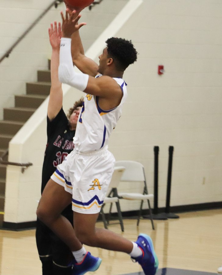 Senior Elijah Ponder (2) is going up for a layup. 