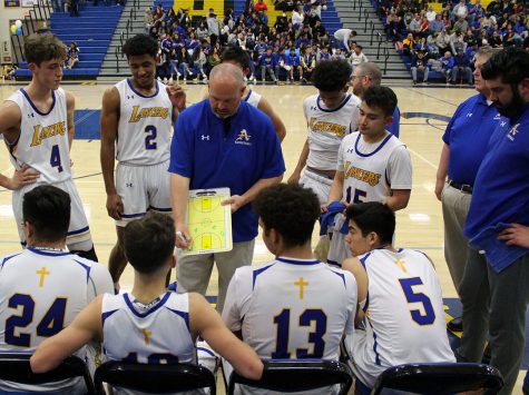 Coach Ertle talks to the team during a time-out.