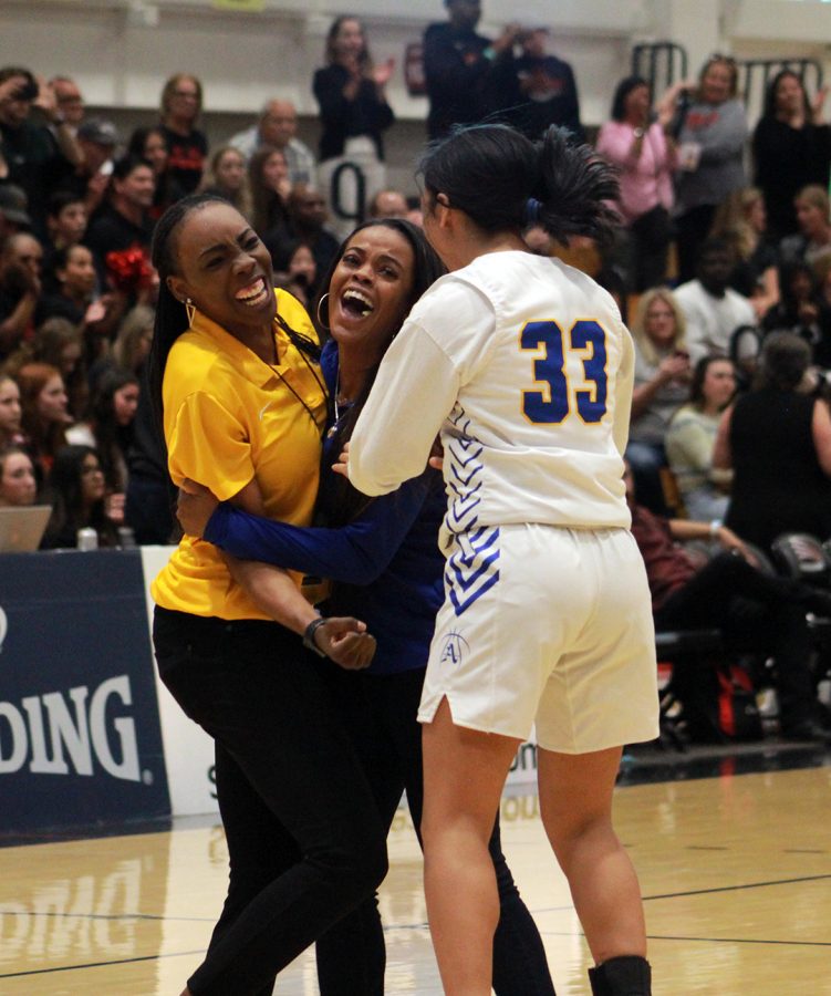 Coach+Buckley+and+assistant+coach+Eric+celebrate+with+Lily+Ramirez.+