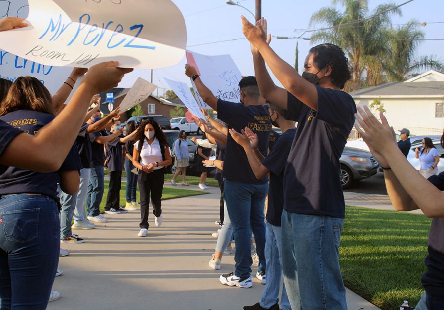 ASB Commisioners welcoming freshman with posters.