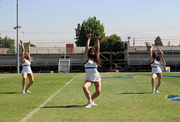 The song girls bringing high spirits for their dance routine.