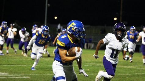 Aiden Ramos on his way to score a touchdown against cathedral game in the kefir stadium.