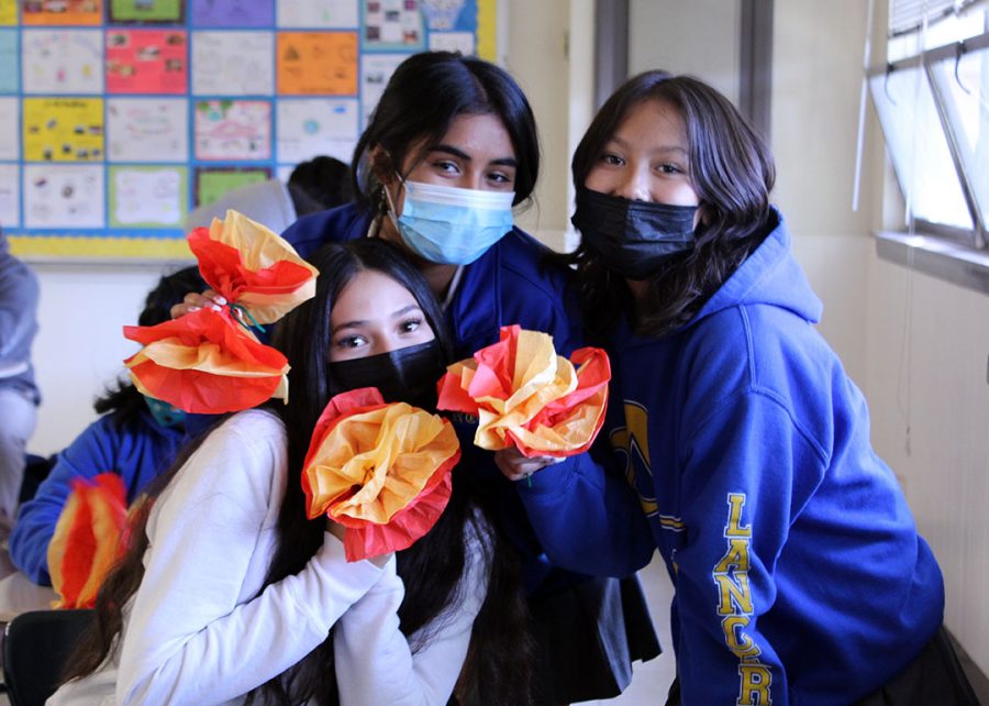 Students showing of their handmade flowers