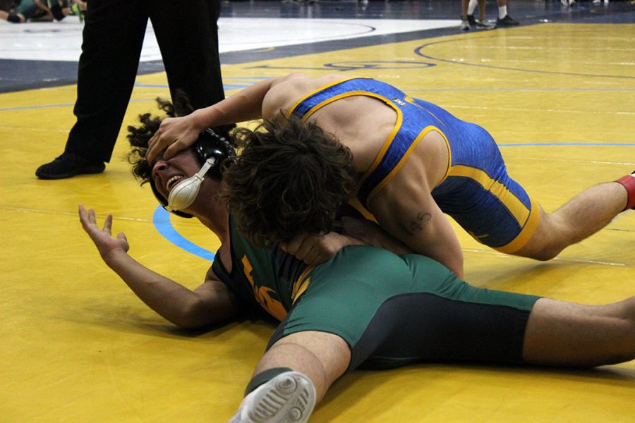 Matthew Abner putting in half on Damien wrestler 