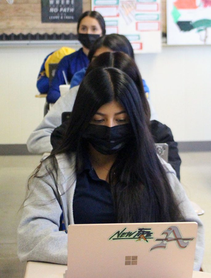 A Bishop Amat student is wearing her mask during class. 