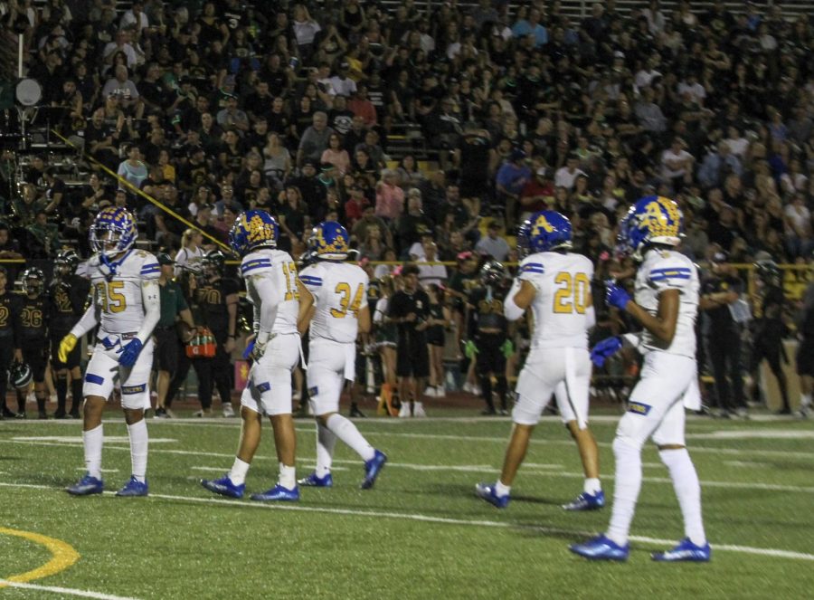 Amat Lancers are lining up for the play against Damien Spartans. 