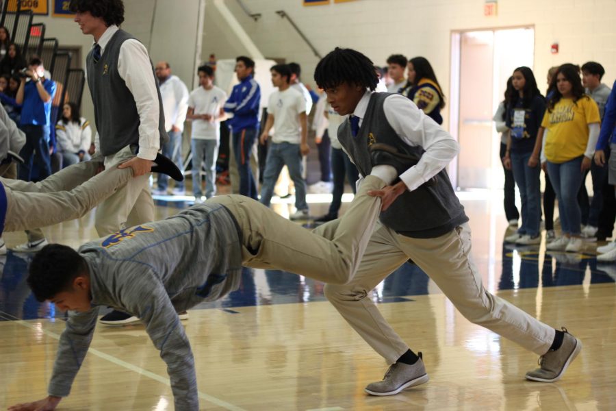 Brandon Witherspoon is holding another student by the legs in a cartwheel race!