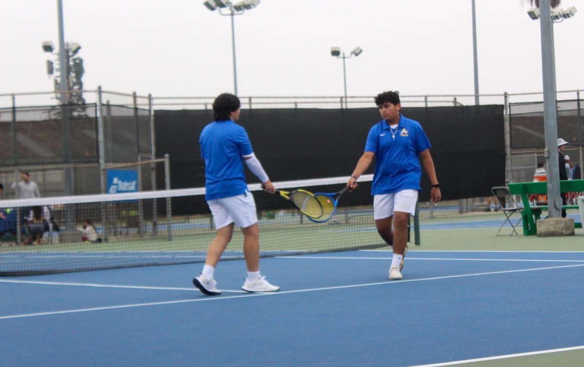 Sophomores Preston Santos and Joseph Jimenez congratulating each other after successfully getting a point against Cathedral’s Bryan Vasquea and Luis Zarala. Santos and Jimenez have shined for the Lancers throughout their seasons and are looking forward to making a good run in the playoffs.