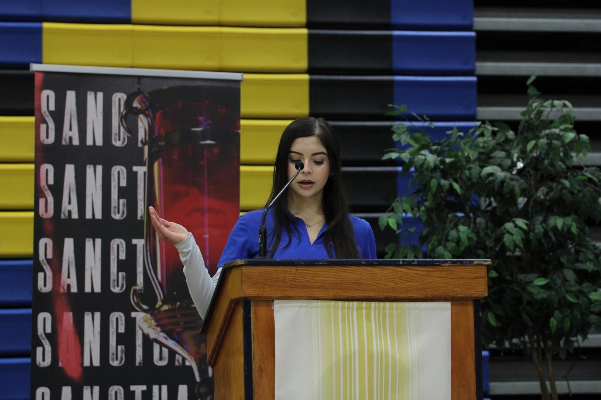 Taylor Mendez reads the first reading to the students. She read clearly and projected her voice for all to hear.