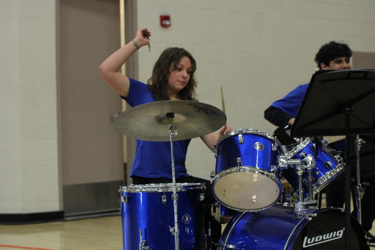 Vea Stone plays the drums for the choir at mass. She played with passion and helped provide a upbeat environment. 